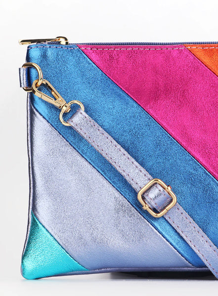 Be fashion-forward and functional with our Leather Rainbow Striped Clutch Bag in lilac. Expertly crafted in Italy, this versatile bag easily transforms from a clutch to a crossbody with a removable strap. Perfect for day or night, its bold rainbow stripe design adds a touch of fun to any outfit.     Rainbow Stripe Italian Leather Wristlet Clutch Gold Hardware Removable Wrist Strap Removable and Adjustable Strap Inner Pocket with Zip Closure 28cm x 19cm x 2cm 100% Leather Wipe Clean