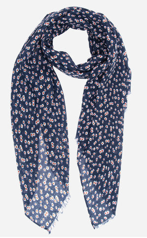 This ditsy floral print scarf in navy blue and cream offers lightweight comfort for all-day wear. Its stylish design makes it a versatile accessory, while its lightweight fabric provides both comfort and style. Elevate your outfit with this must-have scarf.  Material - viscose    180 x 90 cm 