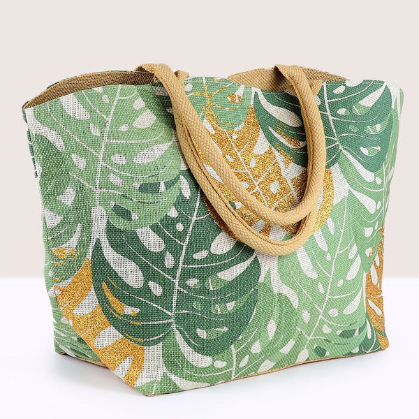 Carry nature with you everywhere you go with our Leaf Jute Bag in a gorgeous green hue. Made from durable jute material, this shopper bag features a beautiful monstera leaf print in gold. Finished with comfortable cotton handles, it's perfect for your everyday errands or a trip to the beach.