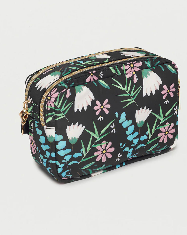 <p>This Floral Crossbody Handbag can easily transform into a cosmetic pouch with its adjustable strap and two zip compartments. Ideal for any occasion, this bag is adorned with a delicate floral print and can hold all your essentials.</p> <p>13cm x 19cm x 8cm&nbsp;</p> <p>Nylon</p>