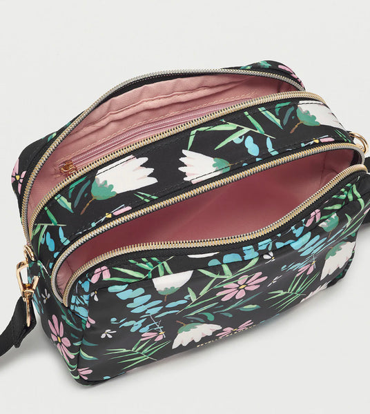 <p>This Floral Crossbody Handbag can easily transform into a cosmetic pouch with its adjustable strap and two zip compartments. Ideal for any occasion, this bag is adorned with a delicate floral print and can hold all your essentials.</p> <p>13cm x 19cm x 8cm&nbsp;</p> <p>Nylon</p>