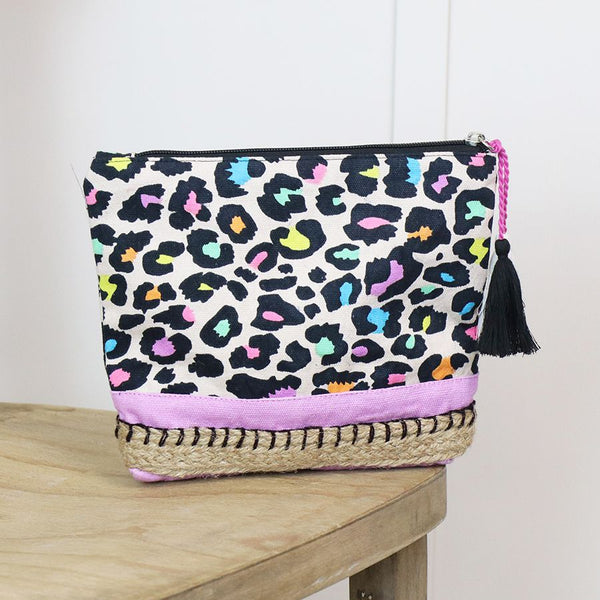 Stay organized and stylish on-the-go with our Multicolour Animal Print Cotton Travel Pouch. Made from lined cotton, it features a vibrant animal print and tassel zip, all finished with a sturdy jute and lilac base. Perfect for storing toiletries, cosmetics, or other travel essentials.