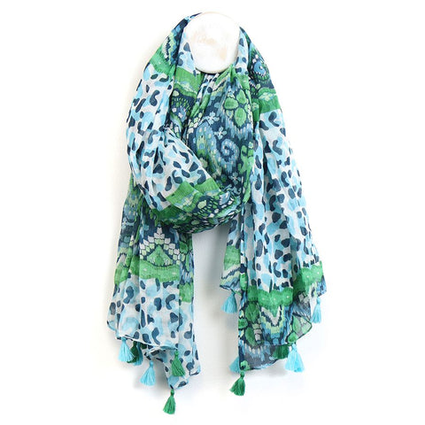 This aqua blue, navy blue, and green mix scarf is perfect for adding a touch of style to any outfit. Made from 100% cotton, it features a camo spot print with unique ikat pattern sections and tassels at each end. Stay warm and fashionable with this versatile and cozy scarf.  Approximate size 110cm x 180cm