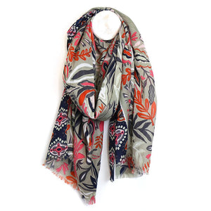 Discover the beauty of nature with our Floral Vines Scarf. This lightweight bamboo viscose scarf features a stunning floral and vine print in neutral tones of beige and navy, accented with a pop of burnt orange. Stay stylish and comfortable with this versatile accessory.  Approximate size 100cm x 180cm