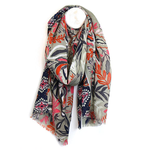 Discover the beauty of nature with our Floral Vines Scarf. This lightweight bamboo viscose scarf features a stunning floral and vine print in neutral tones of beige and navy, accented with a pop of burnt orange. Stay stylish and comfortable with this versatile accessory.  Approximate size 100cm x 180cm