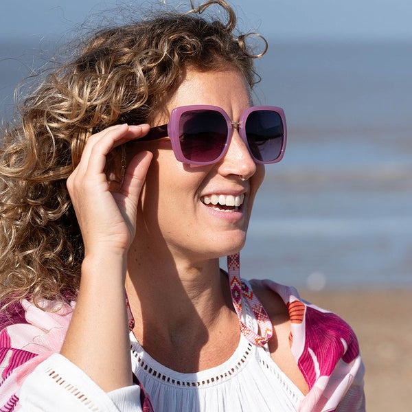 <p>Be environmentally-friendly in style with our Recycled Oversize Sunglasses in Pink. Made from recycled polycarbonate, these sunglasses feature an opaque pink frame and purple ombre lens. Keep them clean with the included recycled cleaning cloth and store them in our eco-friendly case."</p> <p><span>CAT2 UV400</span></p>