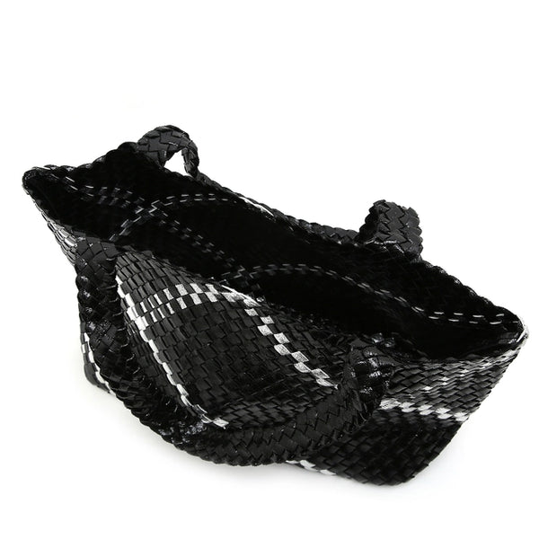 Stylish and functional, our PU leather Large Woven / Weave Tote  is the perfect accessory for the fashion-forward individual. The distinctive wide weave pattern with a silver stripe adds a touch of sophistication to any outfit, making it the ideal choice for your Summer holidays. Stay effortlessly stylish and organized with this must-have tote. Also included is a pouch to keep your valuables safe.  Approx - 45cm (Bottom) 54cm (Top) x 29cm x 19cm