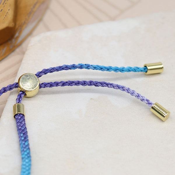 Blue mix cord bracelet with semi-precious beads interspersed with brass spacer beads and an adjustable sliding bead for the perfect fit.