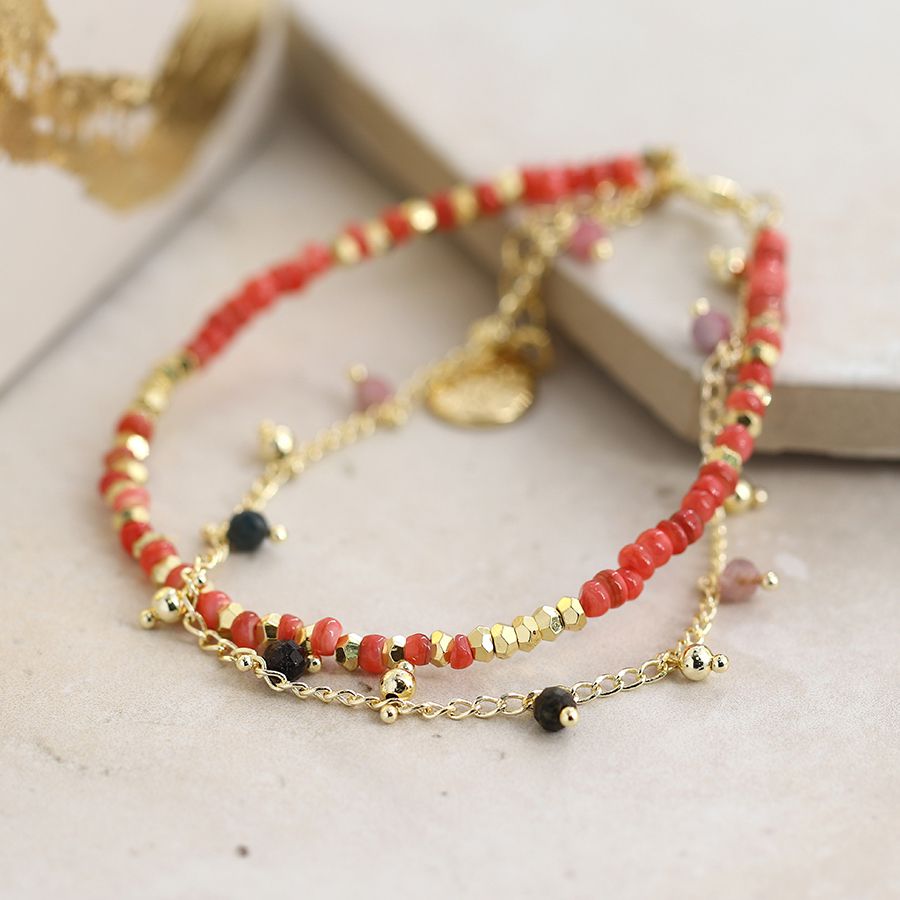 Double strand golden and red bead bracelet with a fine chain and tiny Tourmaline beads, fastened with a golden chain and lobster clasp