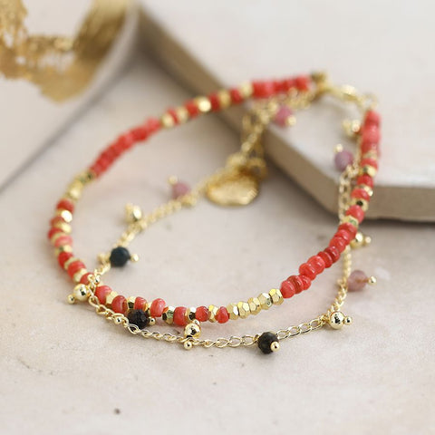 Double strand golden and red bead bracelet with a fine chain and tiny Tourmaline beads, fastened with a golden chain and lobster clasp