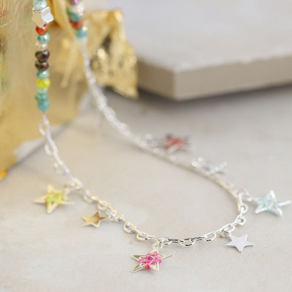 Silver plated fine chain and mixed colour bead necklace with silver plated star charms, colourful thread detail and a silver plated extension chain and clasp