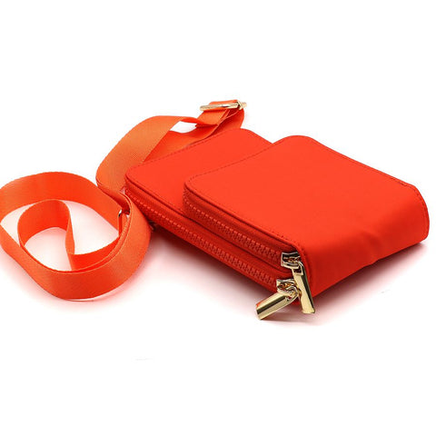 Bright orange phone bag made from recycled nylon with a double zipped pocket design, a vibrant contrasting pink lining and a removable strap. with gold hardware  Approximate size 18cm x 11cm