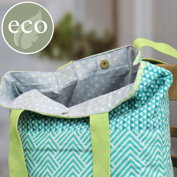 Aqua blue, lime green and white geometric multi print tote bag with star print lining and lime green handles.  Cotton