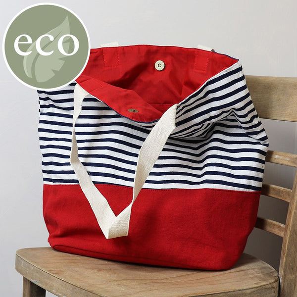 Navy and white cotton stripe beach bag with deep red colour block base and webbing strap.
