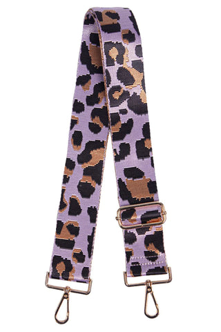 Pair with your favourite handbag and transform your look in an instant. This lilac leopard print detachable bag strap is perfect for parties, nights out and summer festivals.   Bag strap comes with gold hardware.  Product Details: 100% Polyester. 5cm x 140cm.