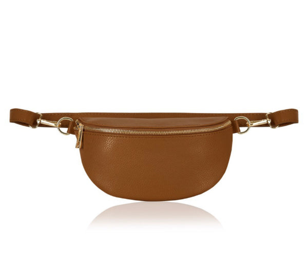  Inga Leather Belt Bag  - Tan  An update of a street-ready design, this ultra-convenient Belt Bag keeps hands free and essentials organized. Crafted in polished pebble leather, wear it cinched at the waist, over the shoulder or draped crossbody for a versatile look.  Gold Hardware  Compatible with our canvas bag straps   L 24 cm x H 12.5 cm x D 3.5 cm